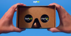 Screenshot of two hands holding Google Cardboard at the website nytimes.com/vr